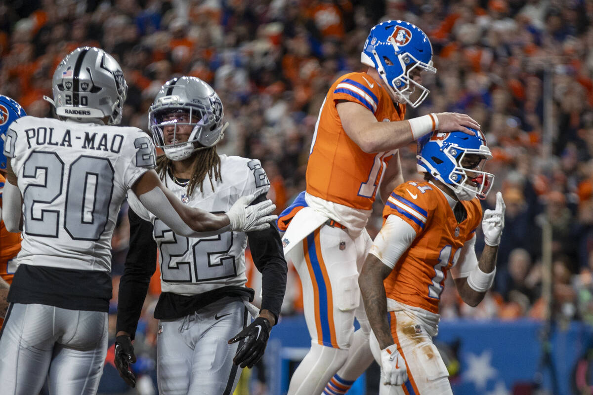 Denver Broncos quarterback Bo Nix (10) and wide receiver Troy Franklin (11) celebrate a touchdo ...
