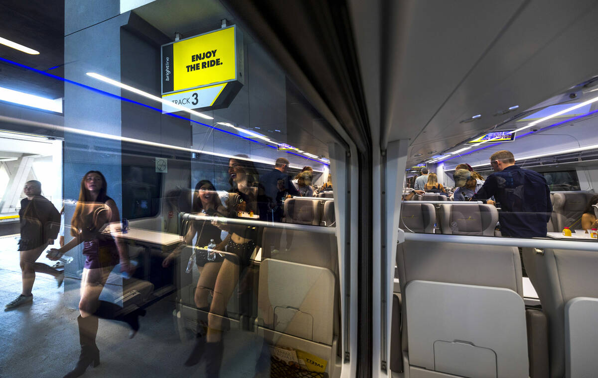 Passengers depart their train arriving at the Brightline MiamiCentral Station on Saturday, Jan. ...