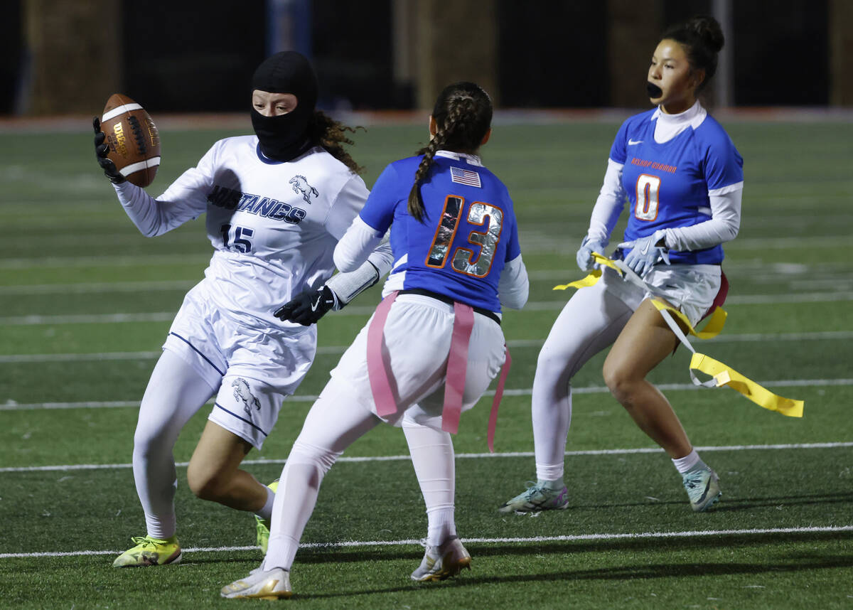 Shadow Ridge's wide receiver Mariah Stevens-Walden (15) gets her flag pulled by Bishop Gor ...