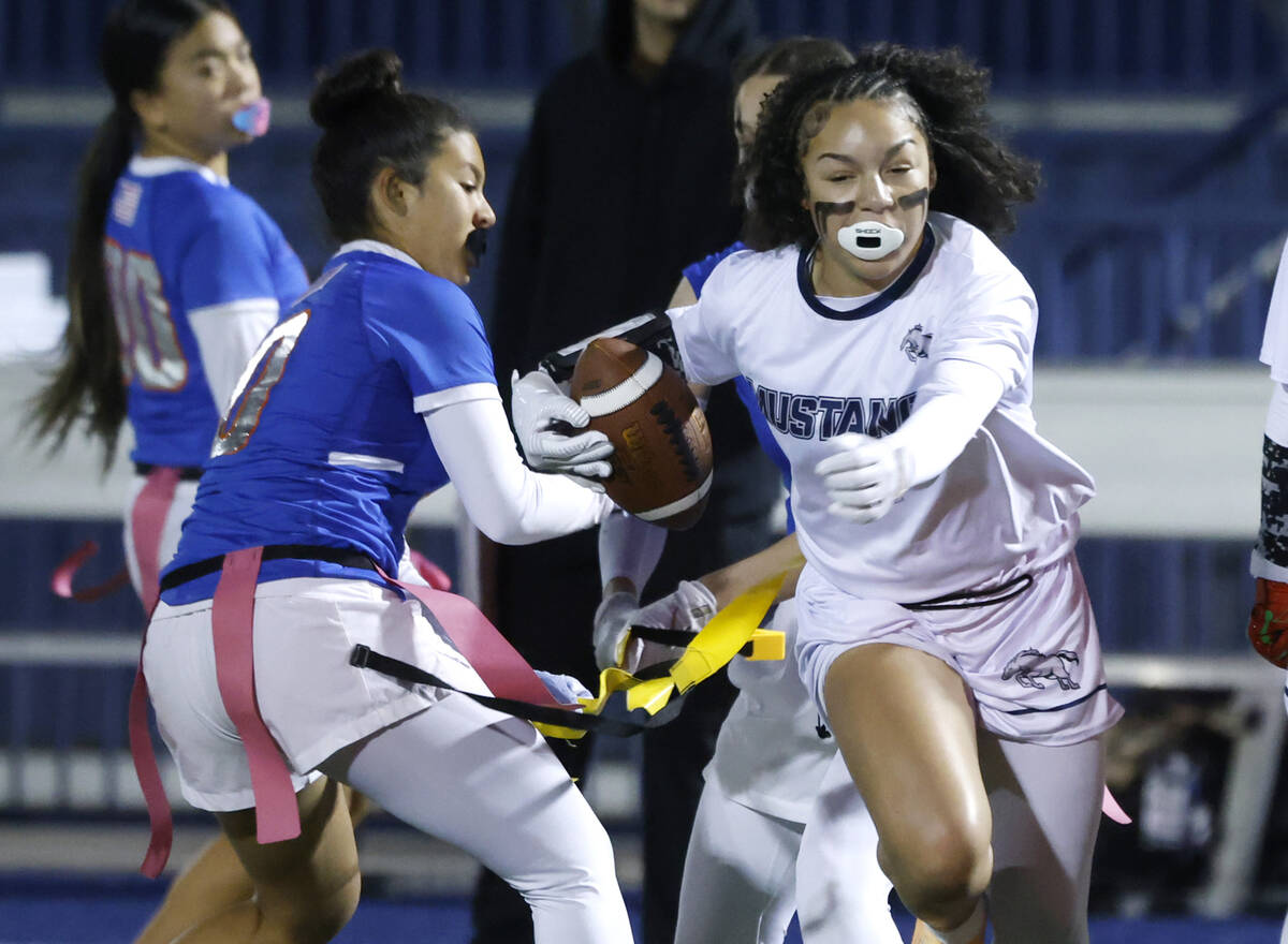 Shadow Ridge's linebacker Presley Walker (4) evades a flag pull by Bishop Gorman's de ...