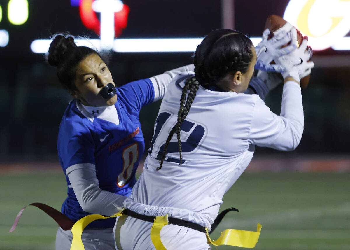 Shadow Ridge's Jaylani Palmer (12) catches a pass as Bishop Gorman's defensive back M ...