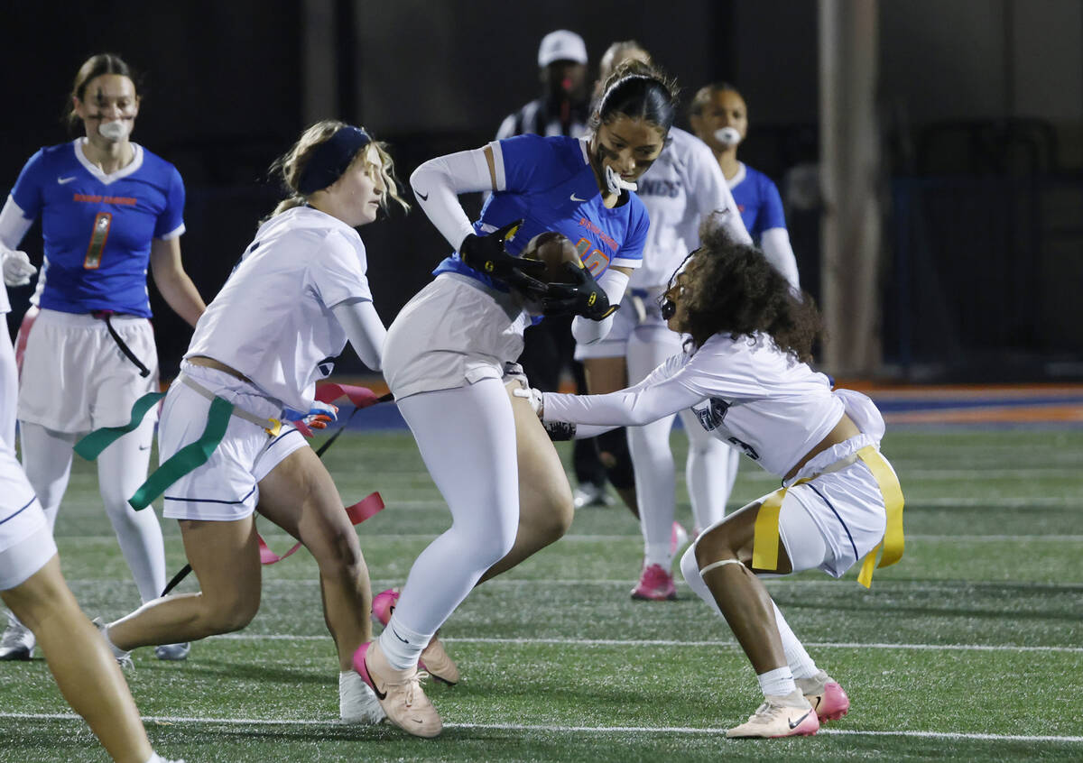 Bishop Gorman's wide receiver Preseah Williams (19) gets her flags pulled by Shadow Ridge& ...