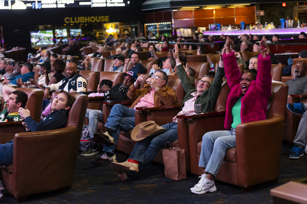 Bettors react to a reception by Seattle Seahawks wide receiver Jaxon Smith-Njigba during the NF ...