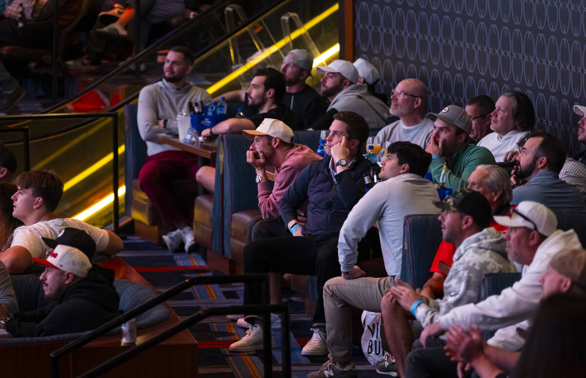 Bettors watch the AFC championship football game between the Broncos and the Patriots at the Ci ...