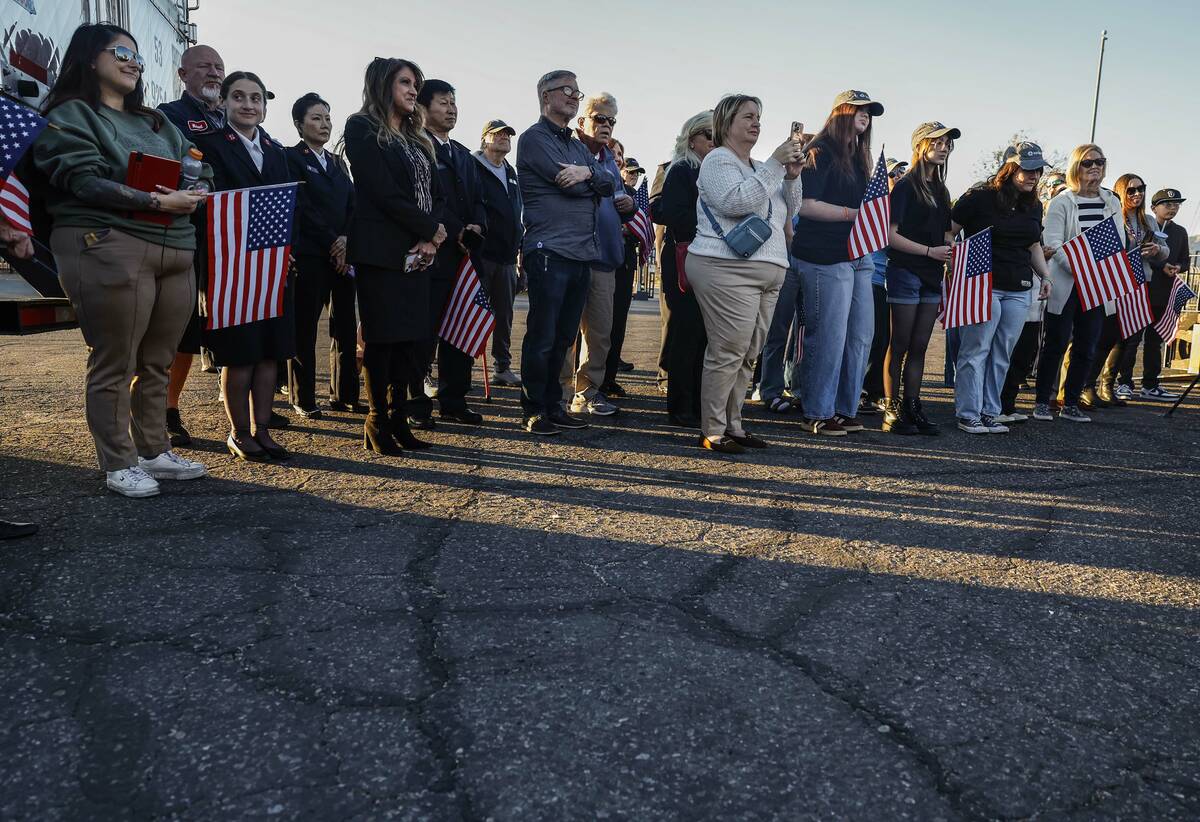 Attendees listen to remarks before a semi-truck carrying approximately 40,000 pounds of Church- ...