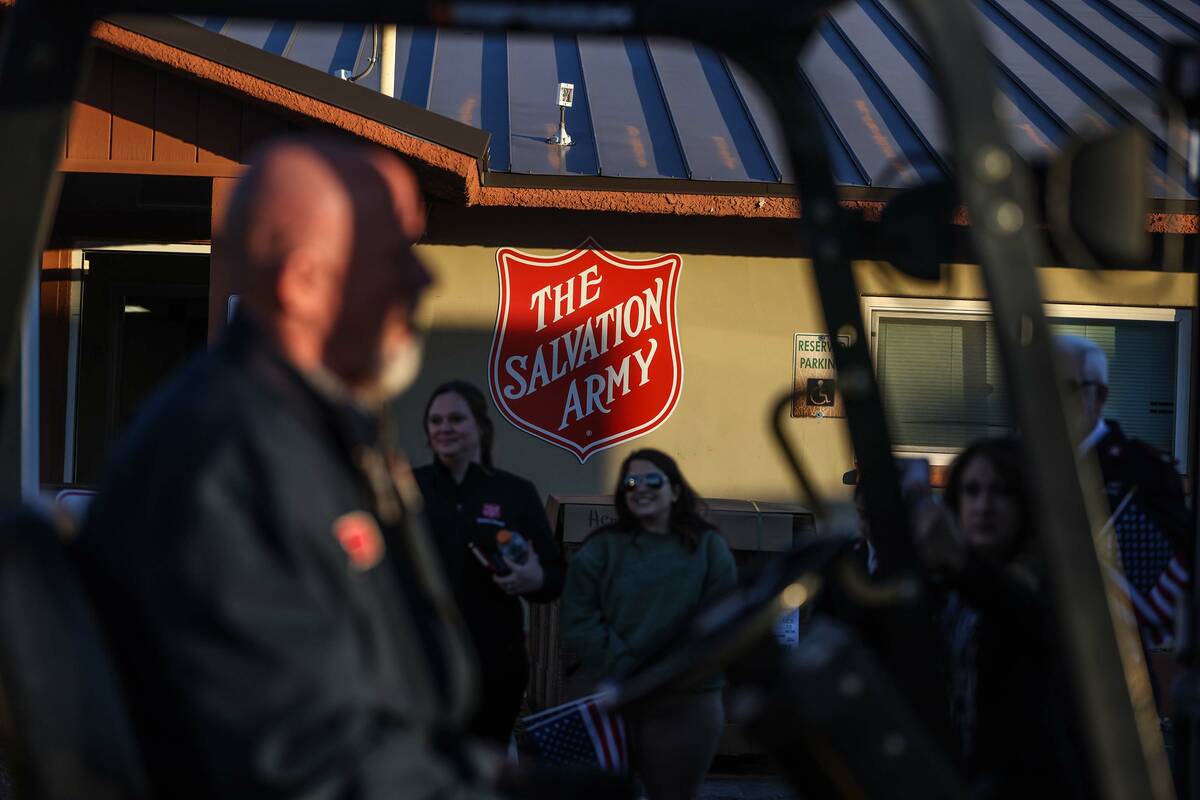 Attendees watch as a forklift unloads a semi-truck carrying approximately 40,000 pounds of Chur ...