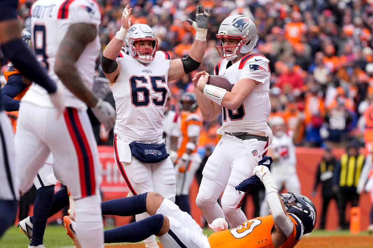 New England Patriots quarterback Drake Maye scores a touchdown against the Denver Broncos as ce ...
