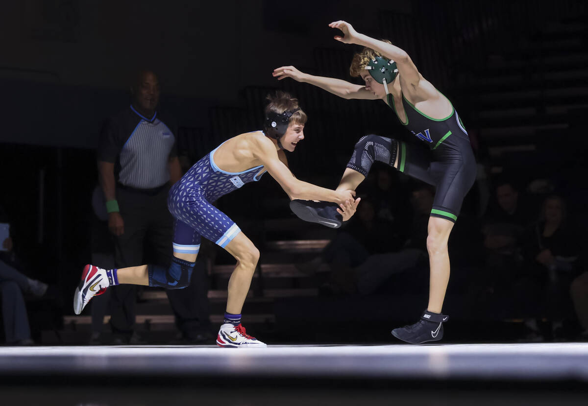 Centennial’s Braiden Foster, left, competes against Green Valley’s Jason Wehren d ...