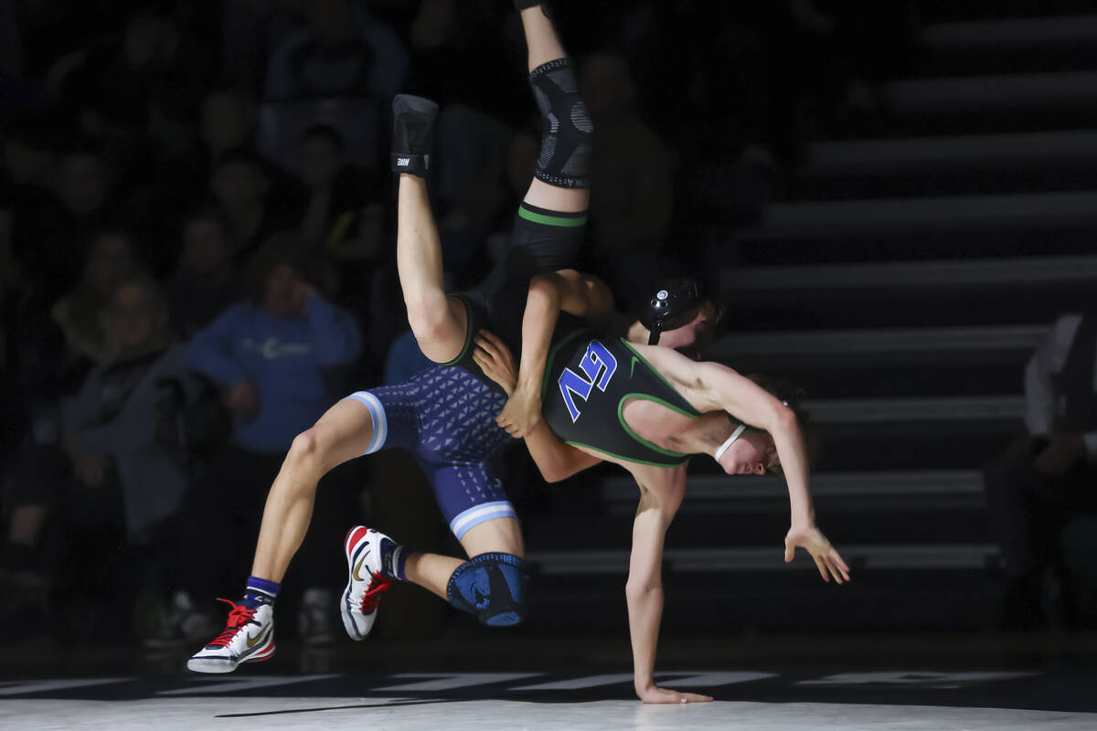 Centennial’s Braiden Foster, left, competes against Green Valley’s Jason Wehren d ...