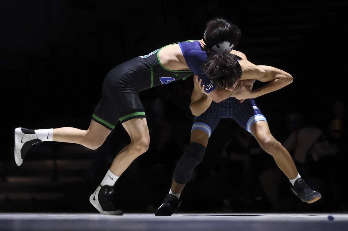 Green Valley’s Elias Montiel, left, competes against Centennial’s Isaac Danielson ...