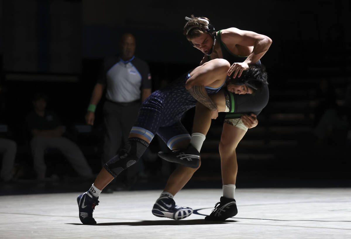 Green Valley’s Elijah Paddock, left, competes against Centennial’s Isaiah Rabago- ...