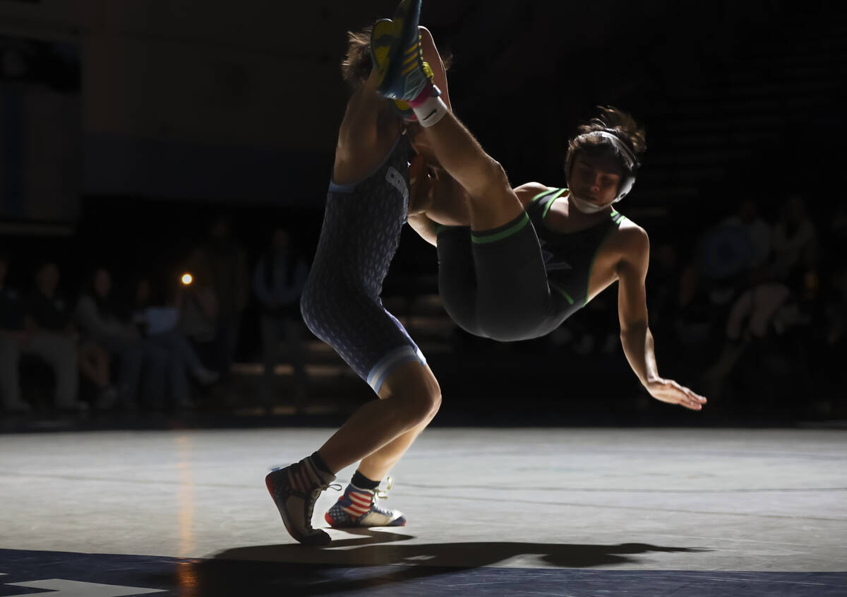 Green Valley’s Cameron Barboza, right, competes against Centennial’s David Castro ...