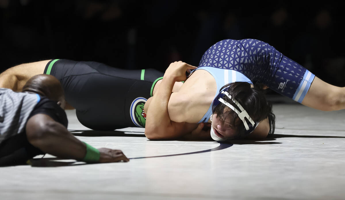 Centennial’s David Castro, left, competes against Green Valley’s Cameron Barboza ...