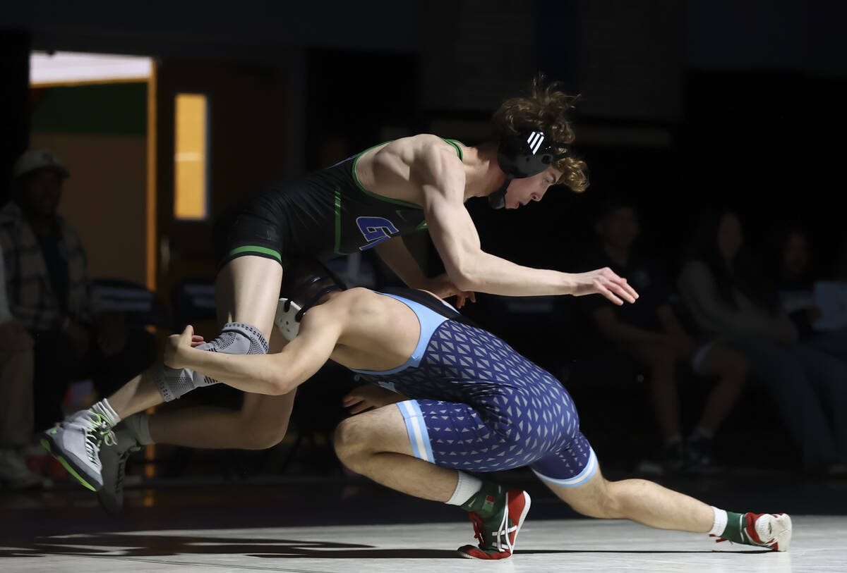 Green Valley’s Eduardo De Posada Campos, left, competes against Centennial’s Gavi ...
