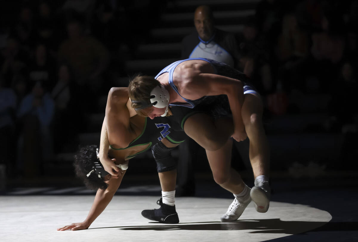 Green Valley’s Armando Ramos, left, competes against Centennial’s Jaden Crutchley ...