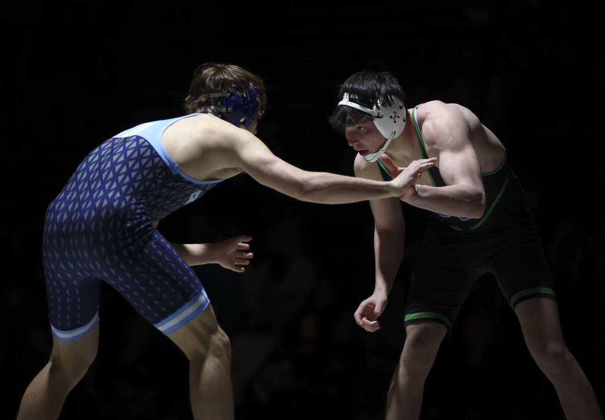 Green Valley’s Marcus Leal, right, competes against Centennial’s Heath Smith duri ...