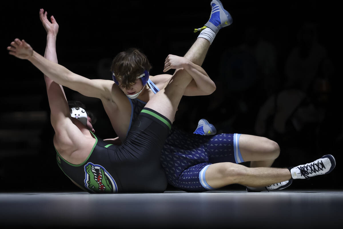 Green Valley’s Marcus Leal, left, competes against Centennial’s Heath Smith durin ...