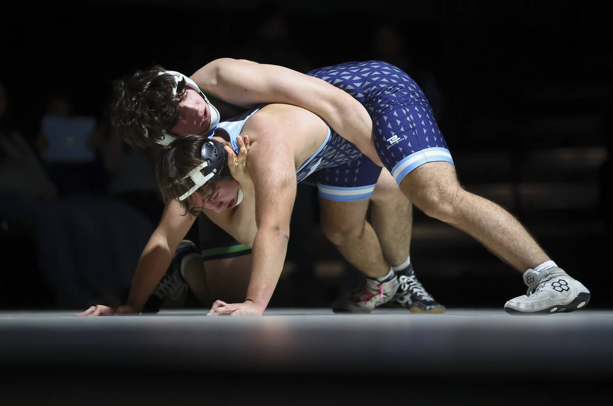 Green Valley’s Daniel Leal, left, competes against Centennial’s Joseph Dacko duri ...