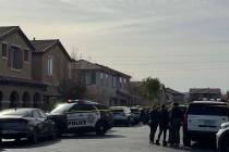 Police investigate the deaths of two people Wednesday, Jan. 28, 2026, in a residence in the 860 ...
