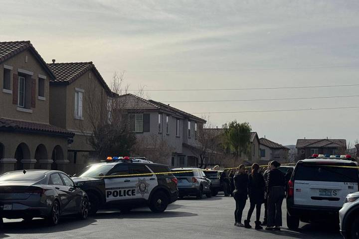 Police investigate the deaths of two people Wednesday, Jan. 28, 2026, in a residence in the 860 ...