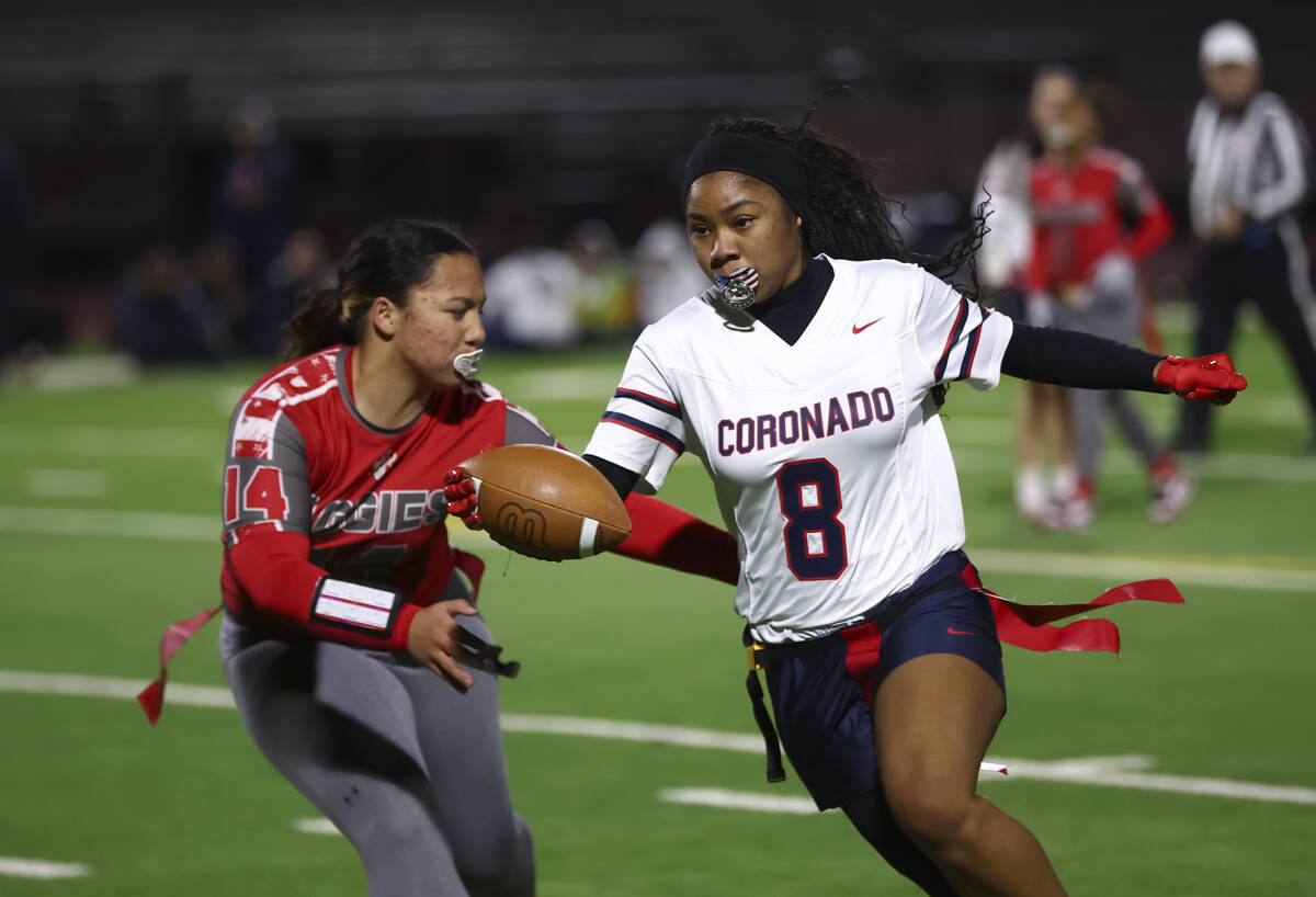 Coronado’s Jordyn Franklin (8) runs the ball against Arbor View’s Karah Foss (14) ...