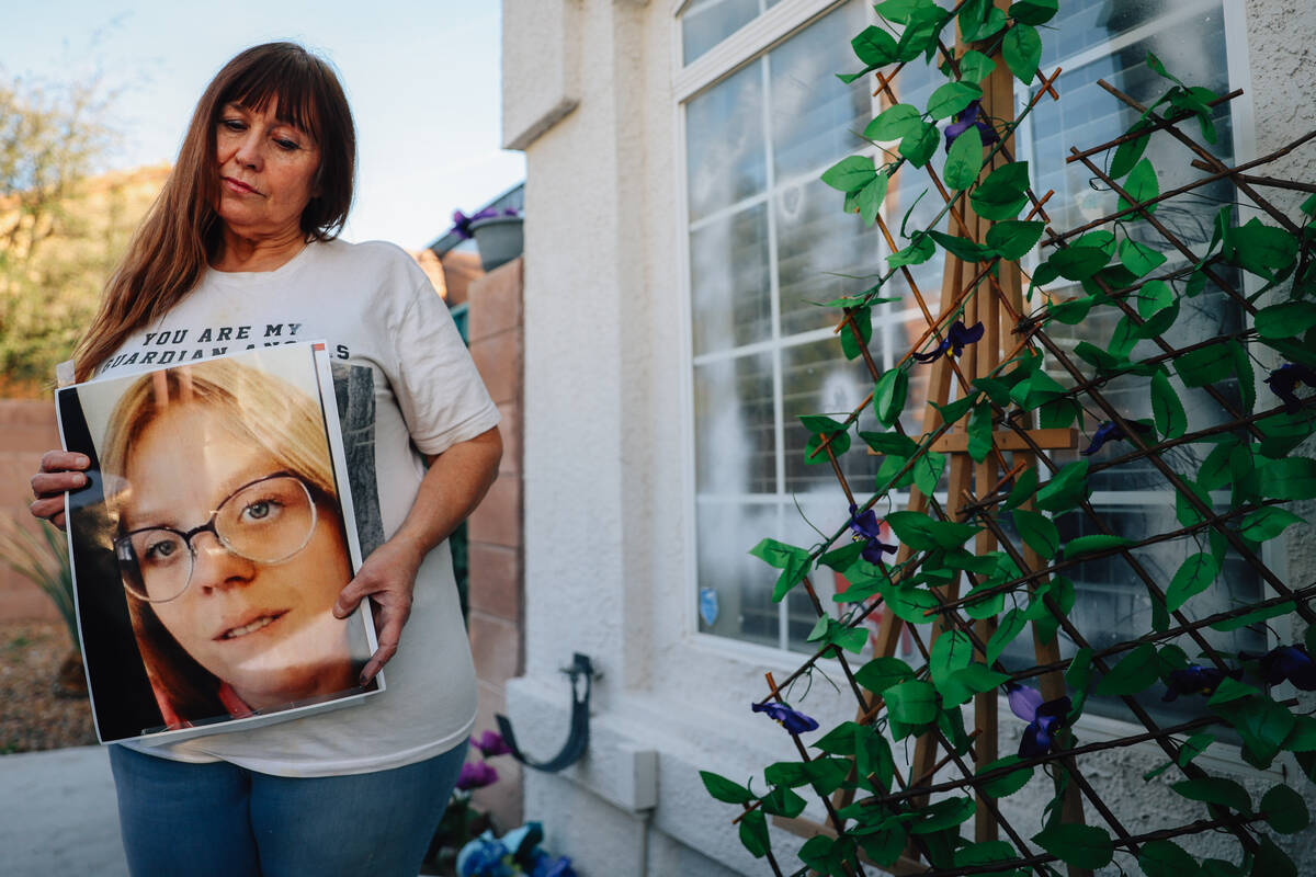 Cheri Brown poses with a photo of her daughter, Amber Brown, who was killed by a reckless drive ...