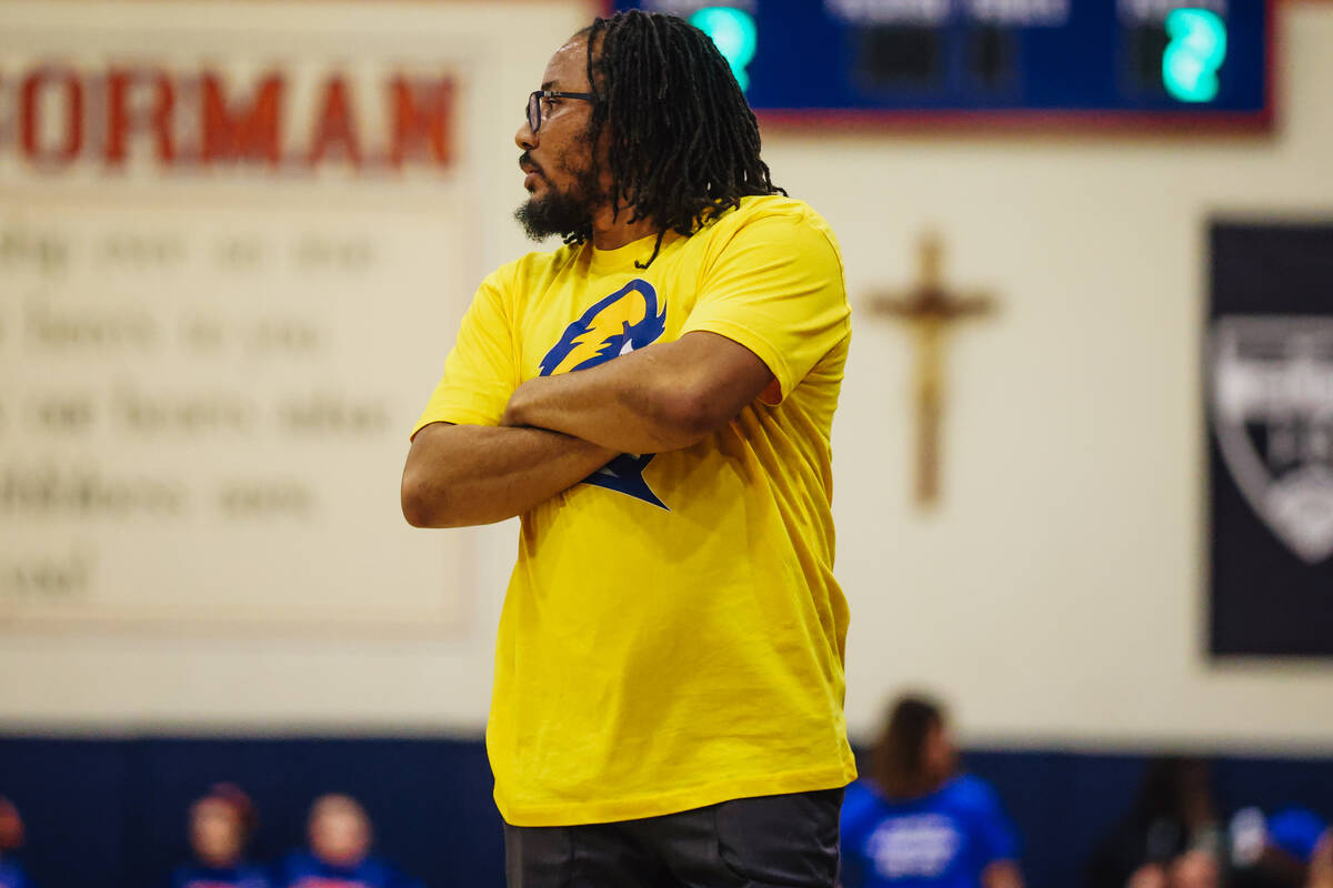 Democracy Prep head coach Julius Barren c coaches from the sidelines during a girls basketball ...