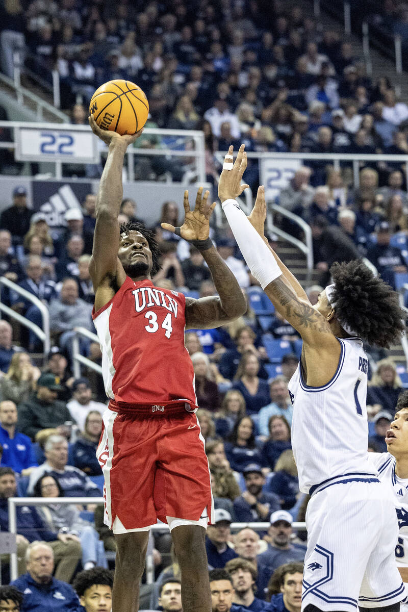 UNLV forward Emmanuel Stephen (34) shoots over UNR forward Elijah Price (1) during their game a ...