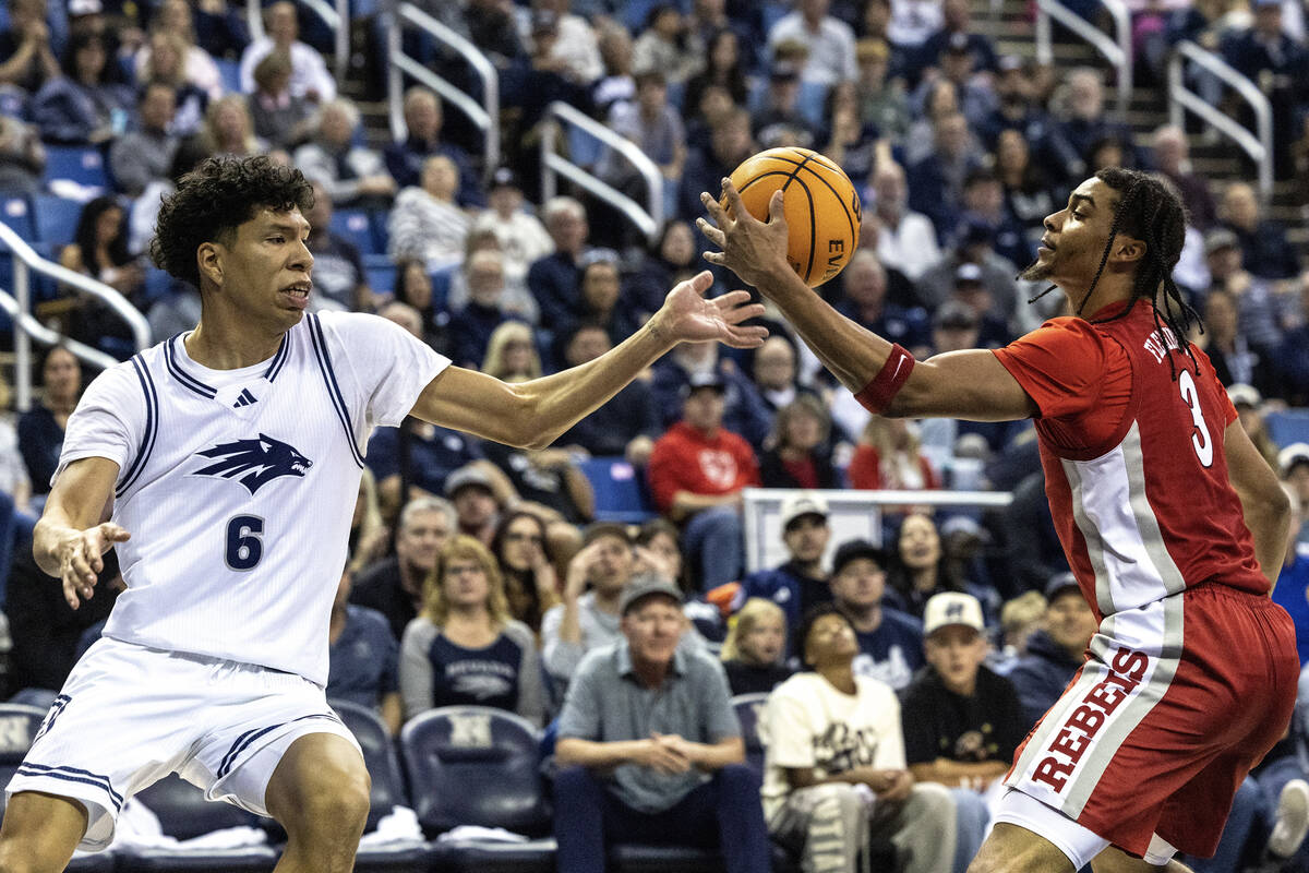 UNLV guard Howie Fleming Jr. (3) grabs the ball from UNR forward Kaleb Lowery (6) during their ...