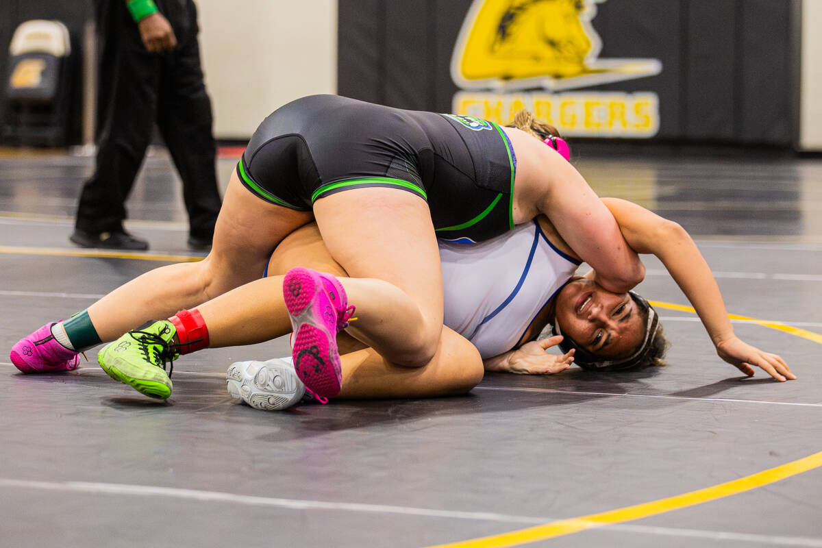 Green Valley wrestler Kaija Ashcroft, top, pins down Coronado’s Jazlynn Maynard during a ...