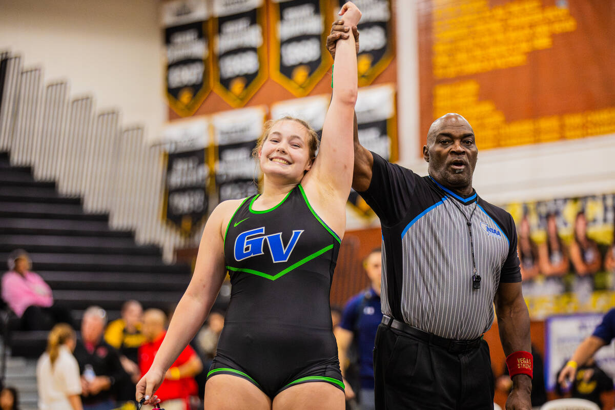 Green Valley wrestler Kaija Ashcroft is declared the winner of her matchup during a high school ...