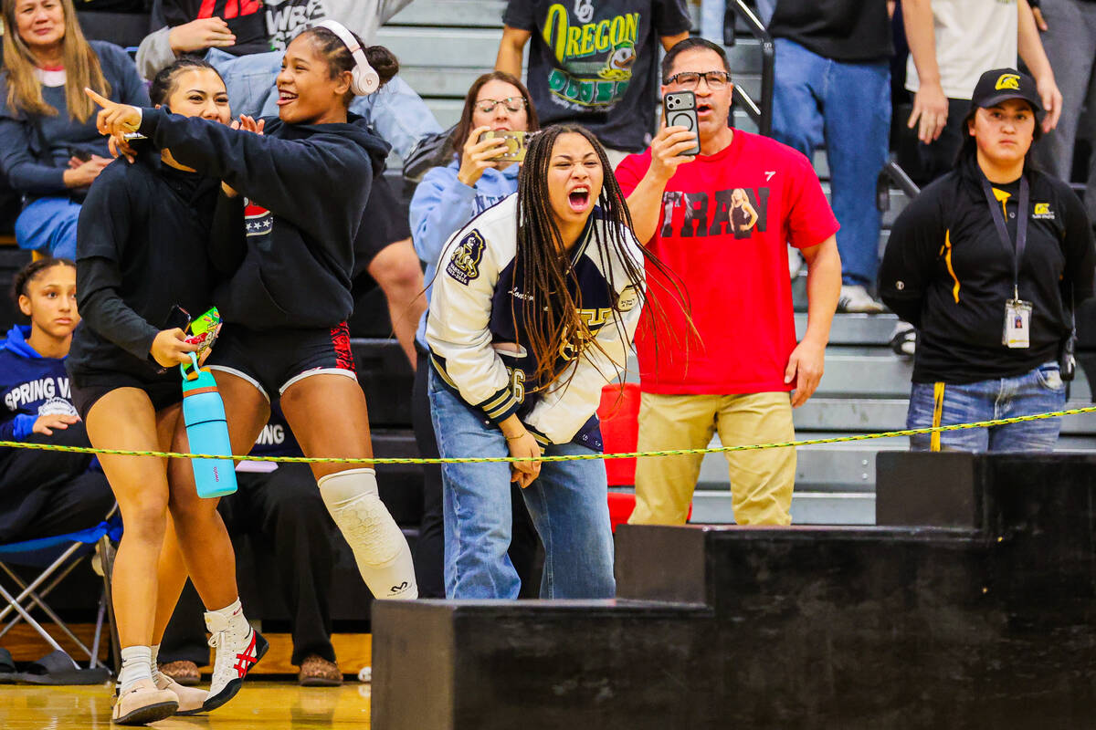 Tylene Tran fans cheer during a high school girls wrestling Southern Region meet at Clark High ...