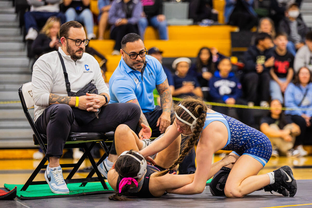 Centennial’s Alina Bardani wrestles with Nolan Lutz of SLAM! Nevada during a high school ...