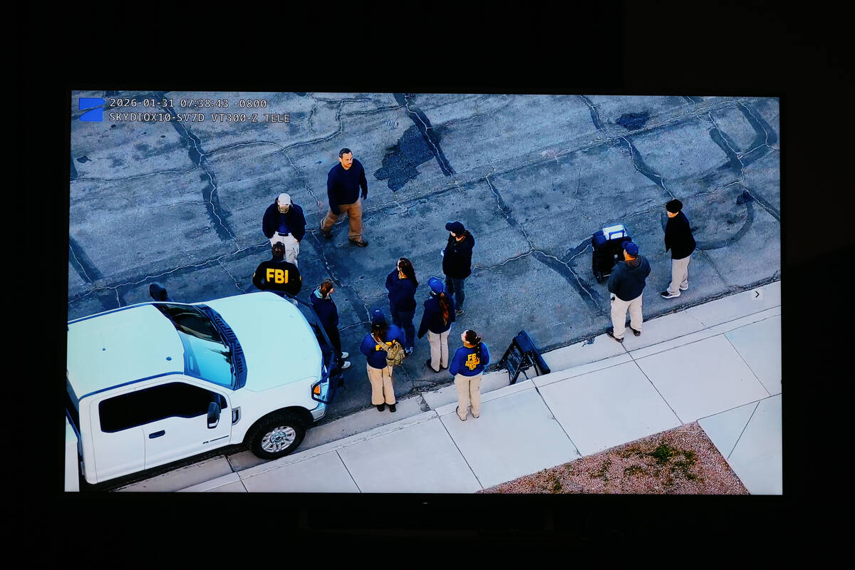 Aerial footage shows an investigation being conducted during a press briefing about a warrant t ...