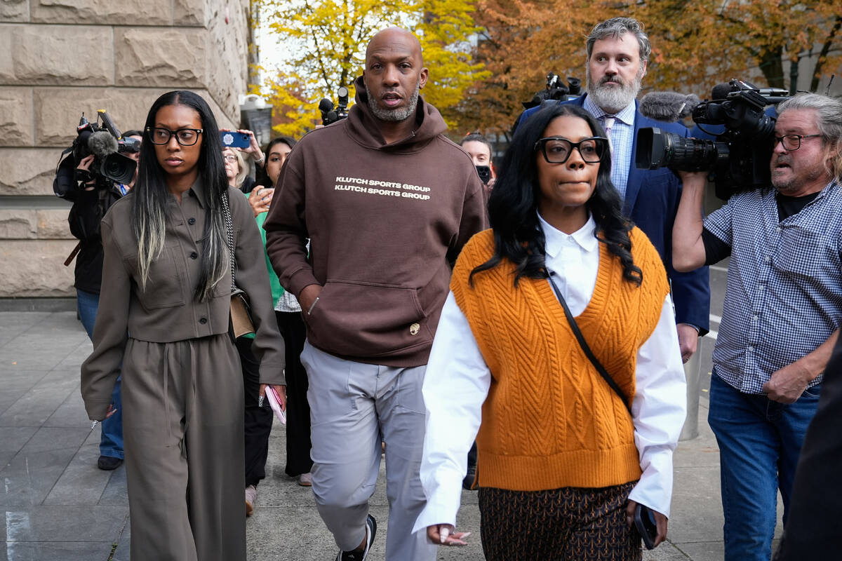 Portland Trail Blazers head coach Chauncey Billups walks to a vehicle after his federal court a ...