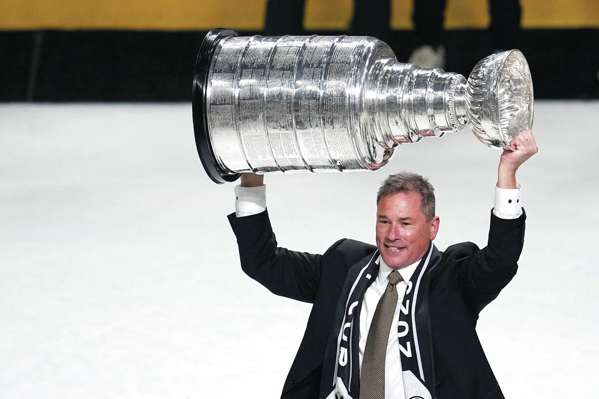 Vegas Golden Knights head coach Bruce Cassidy holds up the Stanley Cup after the Knights defeat ...