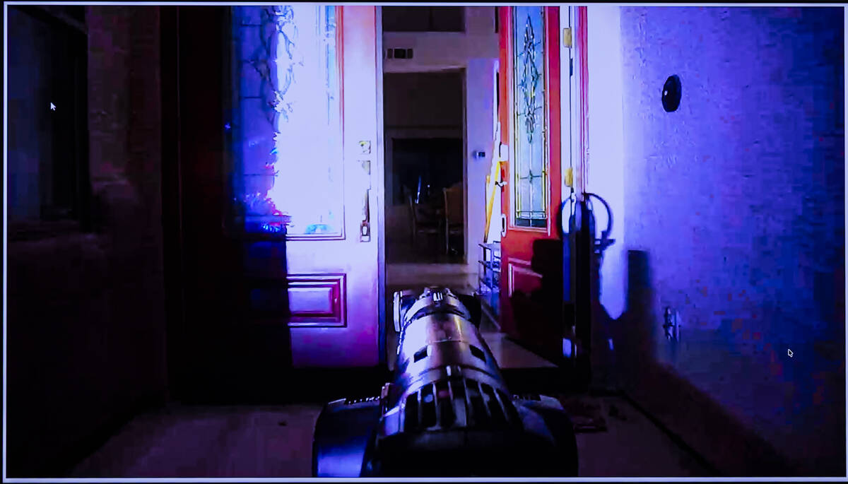 Footage of a robotic dog entering a home containing a possible biological lab is shown during a ...