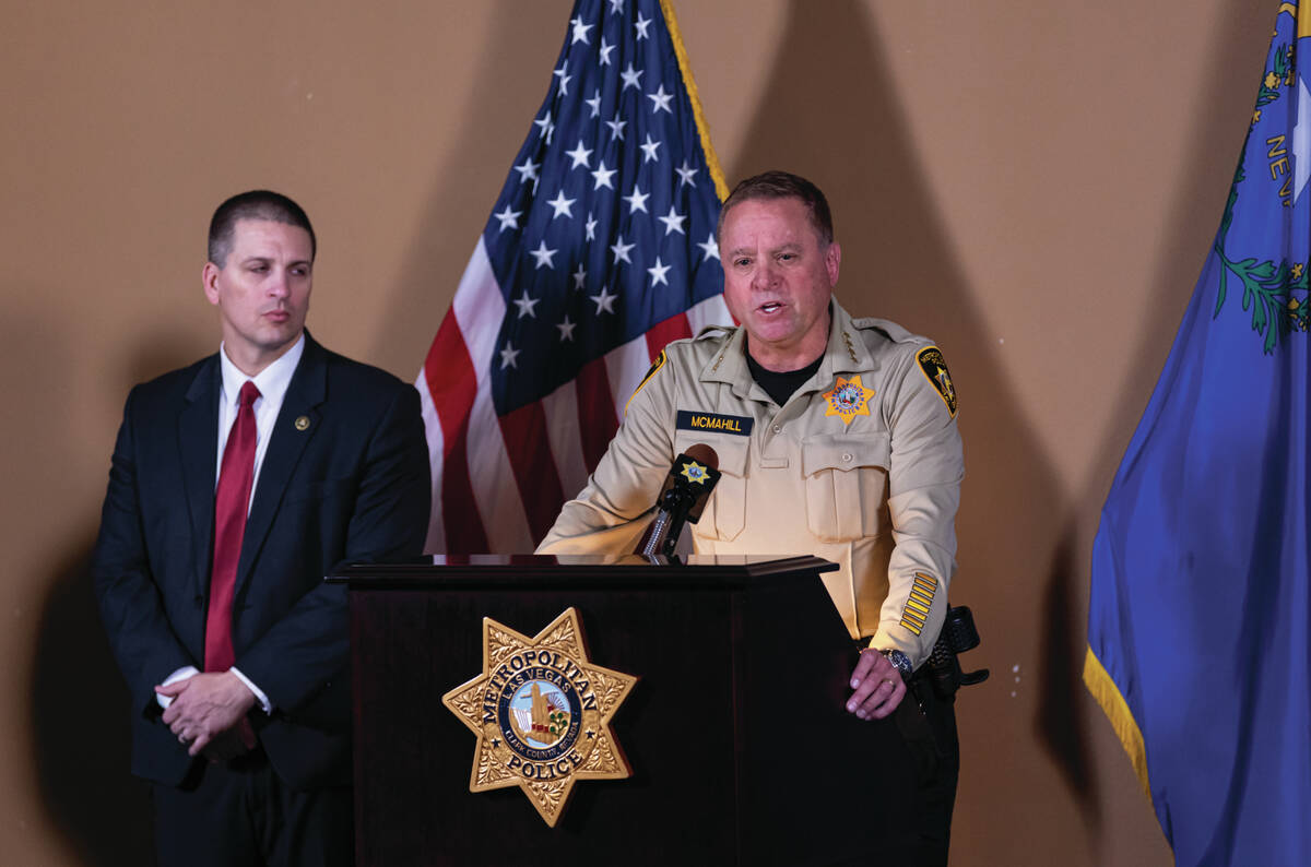 Sheriff Kevin McMahill, right, gives an update alongside Christopher Delzotto, special agent in ...