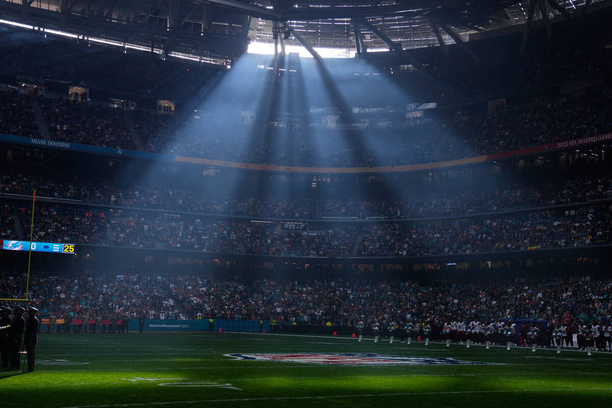 A shaft of sunlight streams into the stadium before an NFL football game between the Washington ...