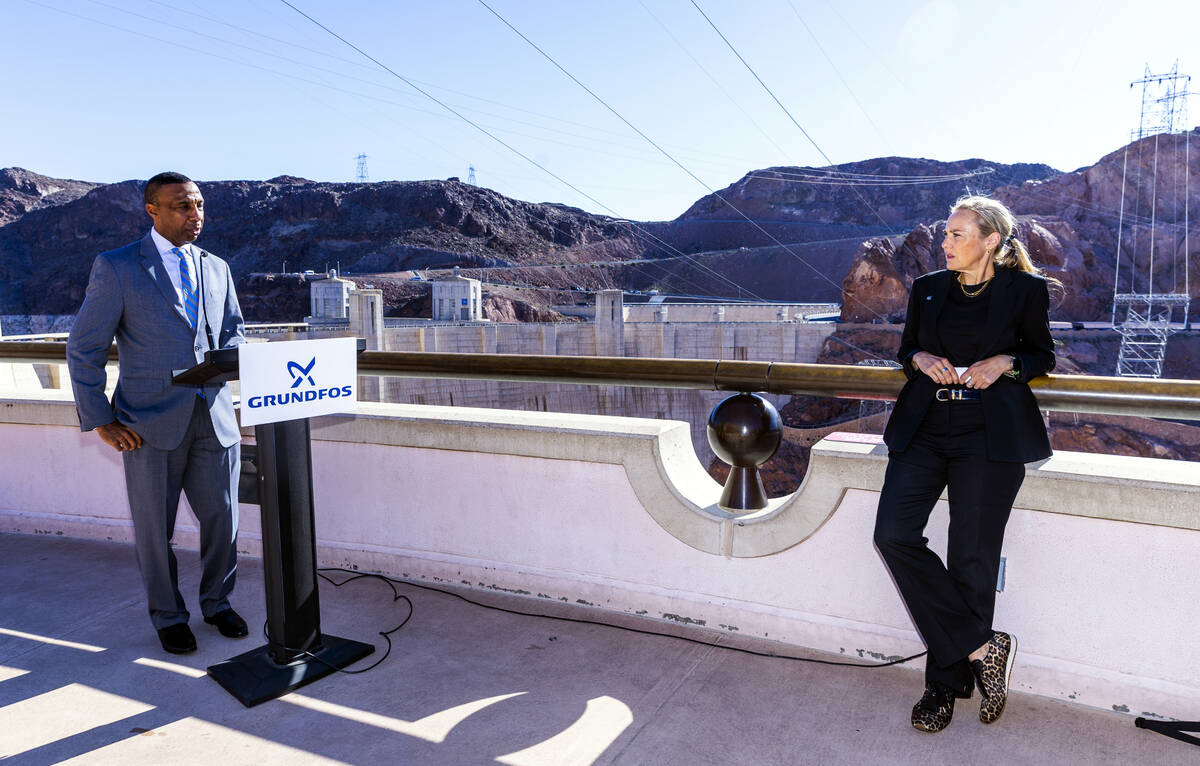 Ansell Sims, president of Grundfos USA, speaks near global water advocate Mina Guli during a pr ...