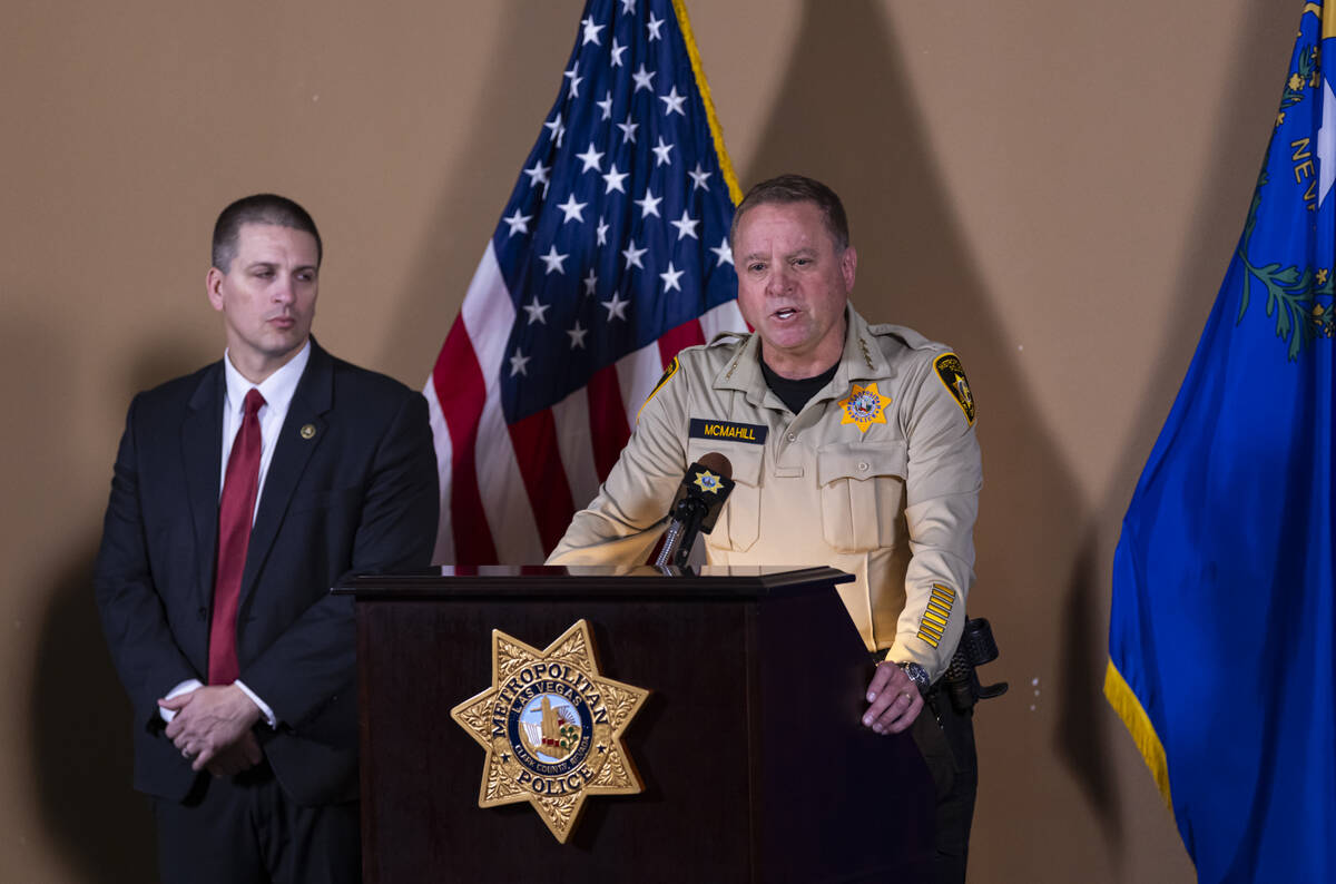 Sheriff Kevin McMahill, right, gives an update alongside Christopher Delzotto, special agent in ...
