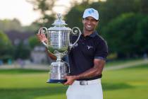 Aaron Rai, of England, holds the Wanamaker Trophy after winning the PGA Championship golf tourn ...