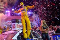 Kyle Busch, Joe Gibbs Racing, Toyota Camry M&M's Red White & Blue celebrates after winning the ...