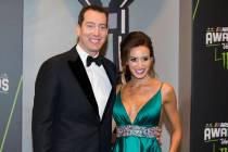 Kyle and Samantha Busch take photos during the Fan Red Carpet on Thursday, Nov. 29, 2018, at Wy ...