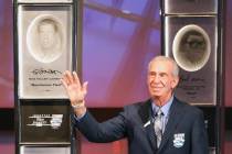 Ned Jarrett waves to the crowd after being inducted into the NASCAR Hall of Fame in Charlotte, ...
