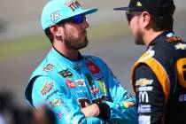 Kyle Busch, left, talks with Kurt Busch before qualifying for the Monster Energy NASCAR Cup Ser ...