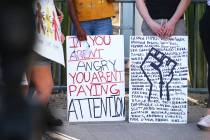 People participate in a Black Lives Matter protest outside of Las Vegas City Hall in 2020. (Las ...