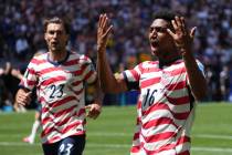 United States' Joe Scally (23) and Alex Freeman (16) react after the World Cup Group D soc ...