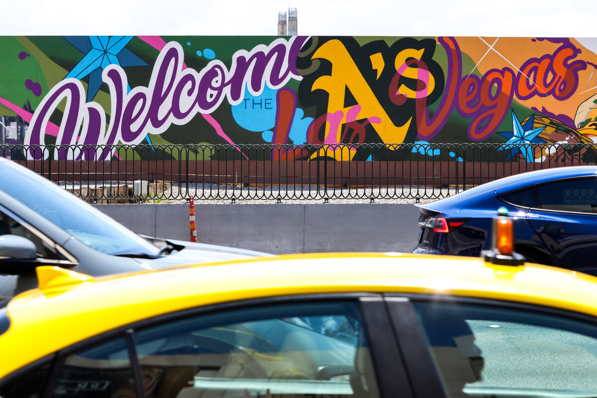 A mural painted by Las Vegas muralist and tattoo artist Brett Rosepiler, is seen along the cons ...