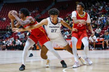 Houston Rockets forward Isaiah Crawford (27) grabs the ball and keeps it out of reach of Memphi ...